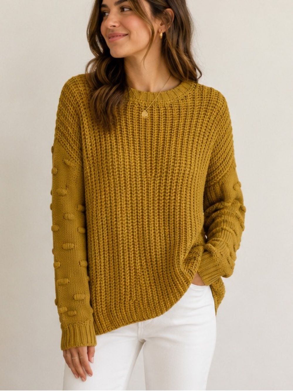 Women's size small golden yellow long sleeve sweater with bubble details